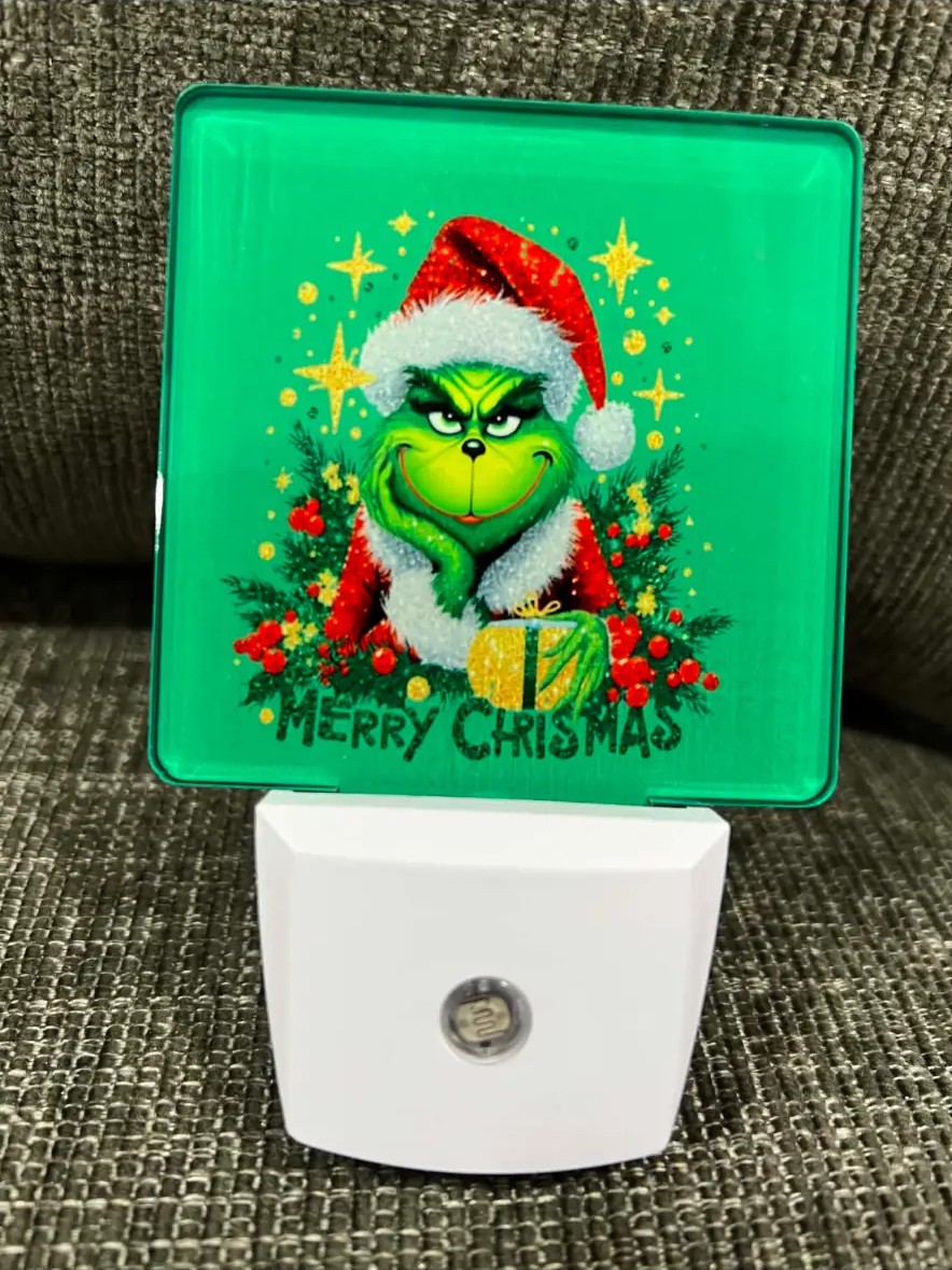 Green holiday night light with a printed design
