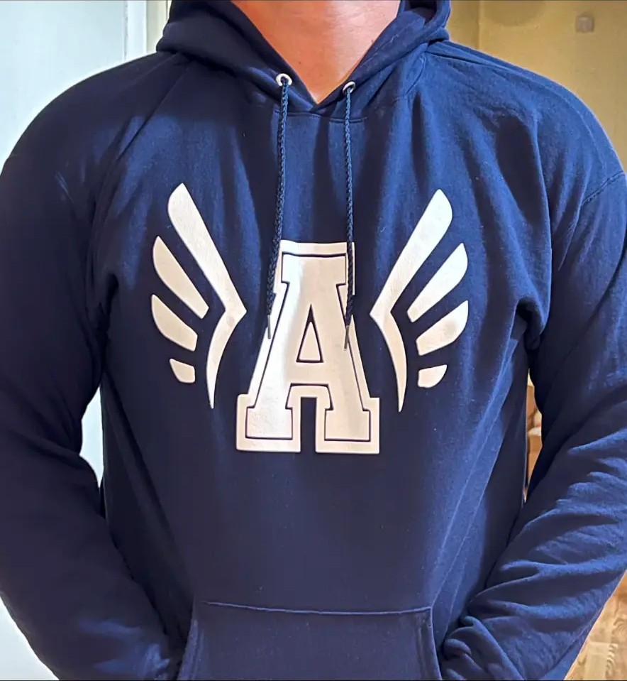 Navy hoodie with a custom winged letter design